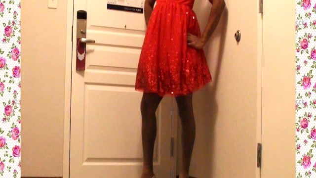 A 1950's SISSY DANCE FOR HER HUSBAND WEARING A PARTY DRESS