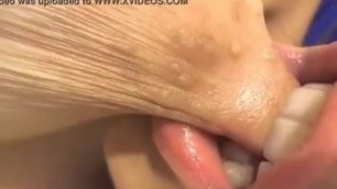 Girl sucking her own nipple